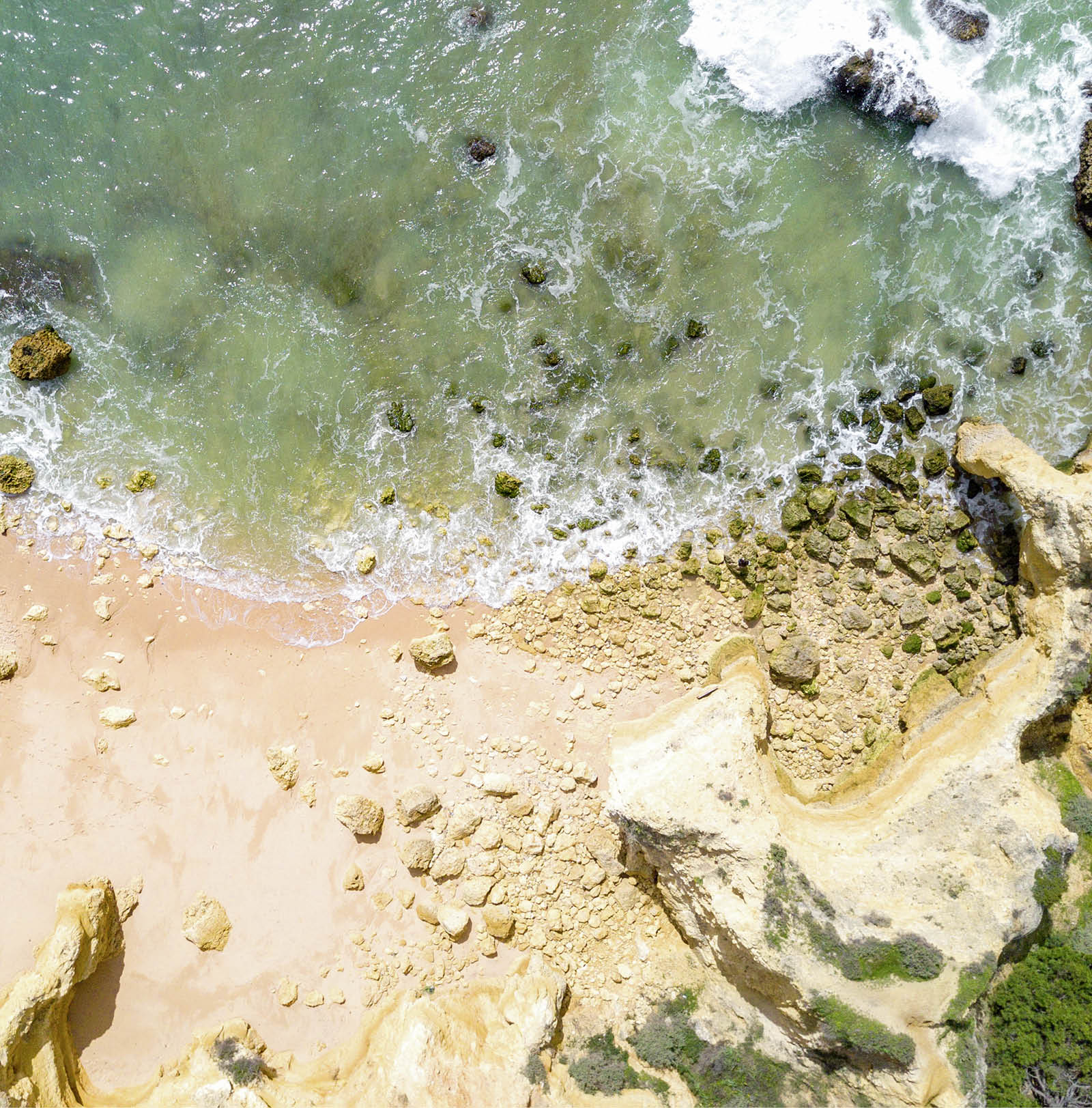 Aerial view of tropical sandy beach and ocean with turquoise water 